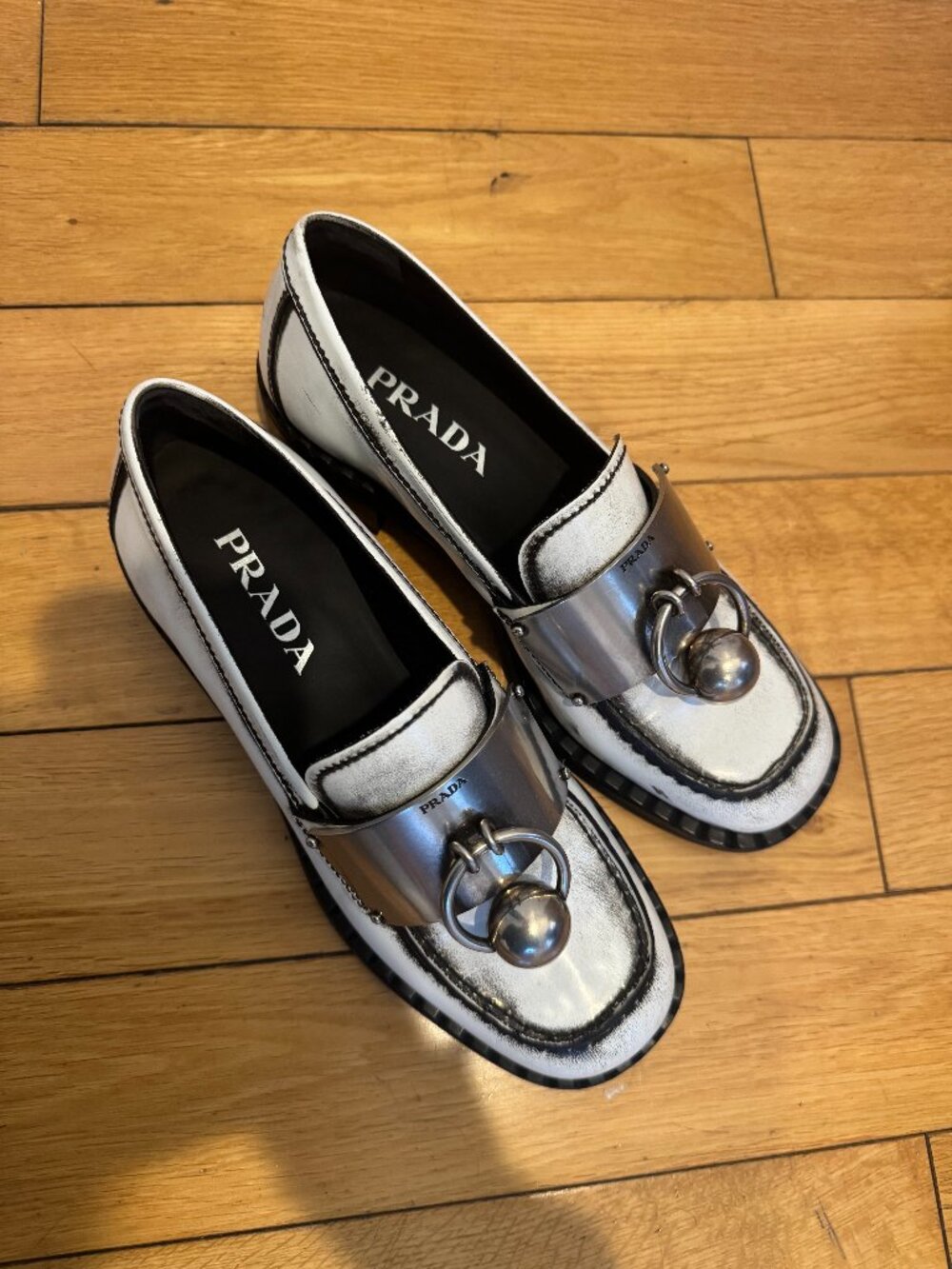 Prada Enameled Metal Triangle Leather Loafers in White